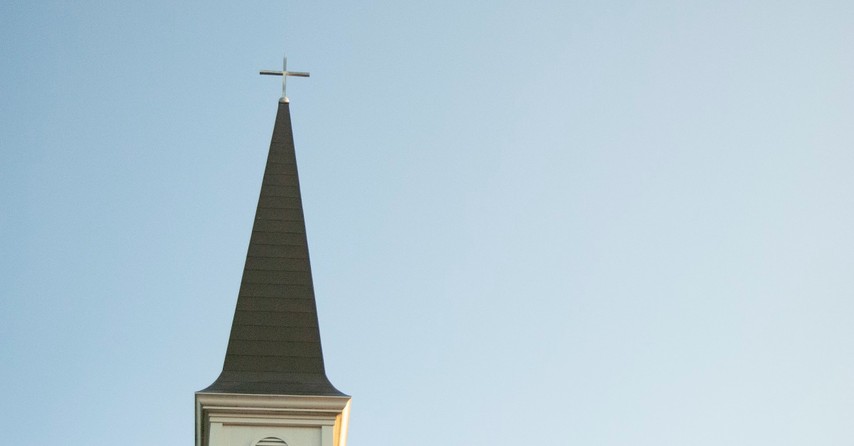 Church steeple against a blue sky