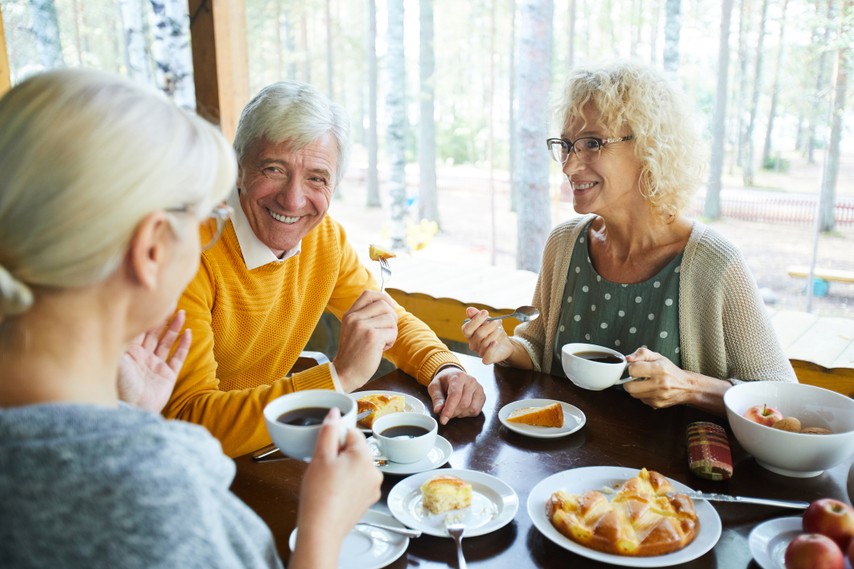 Older adults sharing a meal together