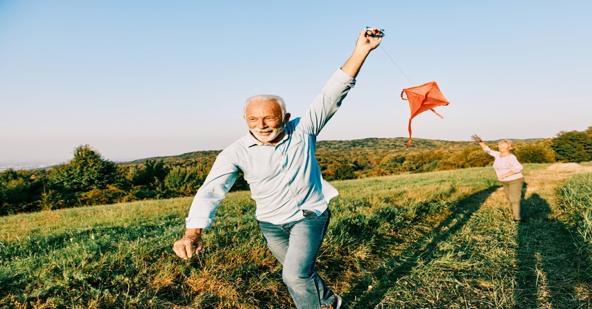 outdoor senior couple flying a kite, jesus gives abundant life