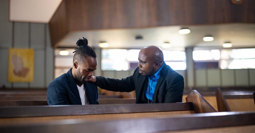 Pastor comforting a congregant