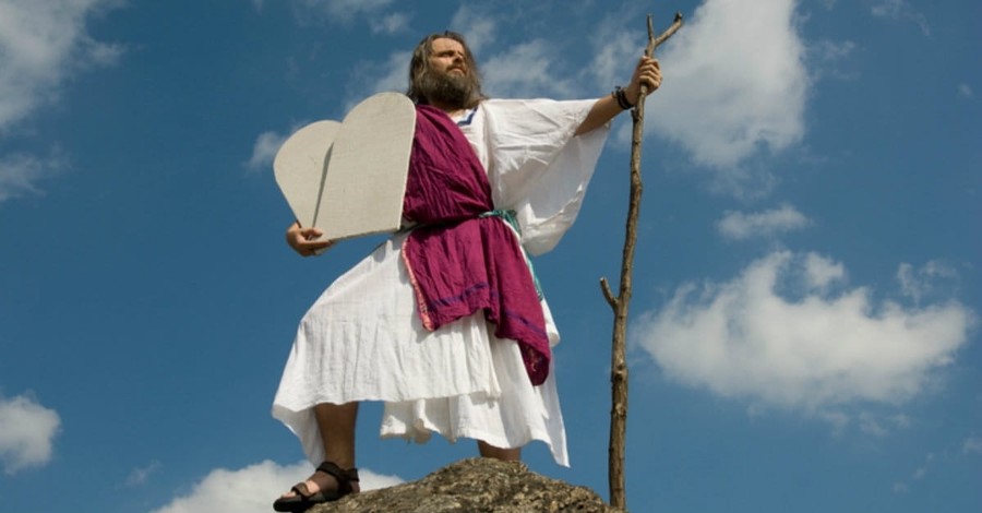 Moses holding tablets on mountain top