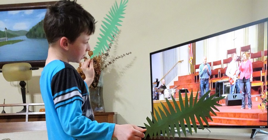 A kid watching virtual Sunday school, churches bring Sunday school home