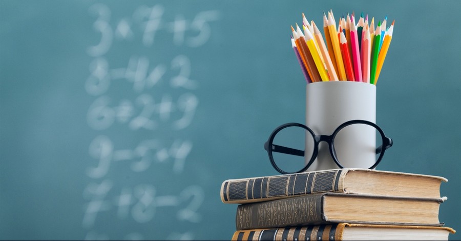 Chalk board, pencils, glasses, books