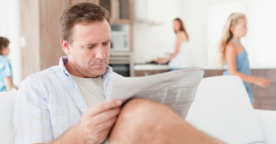 man dad reading the newspaper