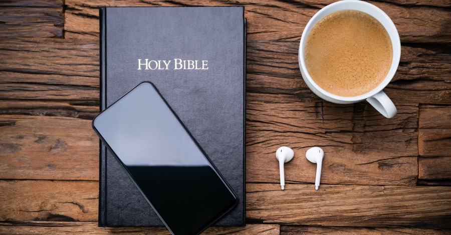 A bible with a phone and headphones, an audio Bible completely narrated by women is released