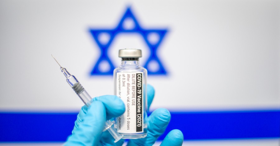 Israeli flag and the COVID-19 vaccine, Israel leads the world in COVID-19 vaccine distribution