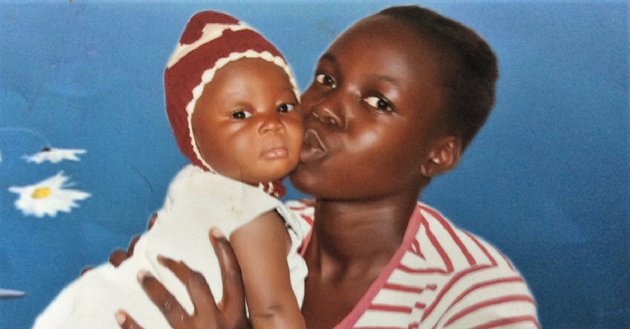 Ladi Moses holding his nephew, Ladi Moses is killed in an attack by suspected Fulani herdsmen