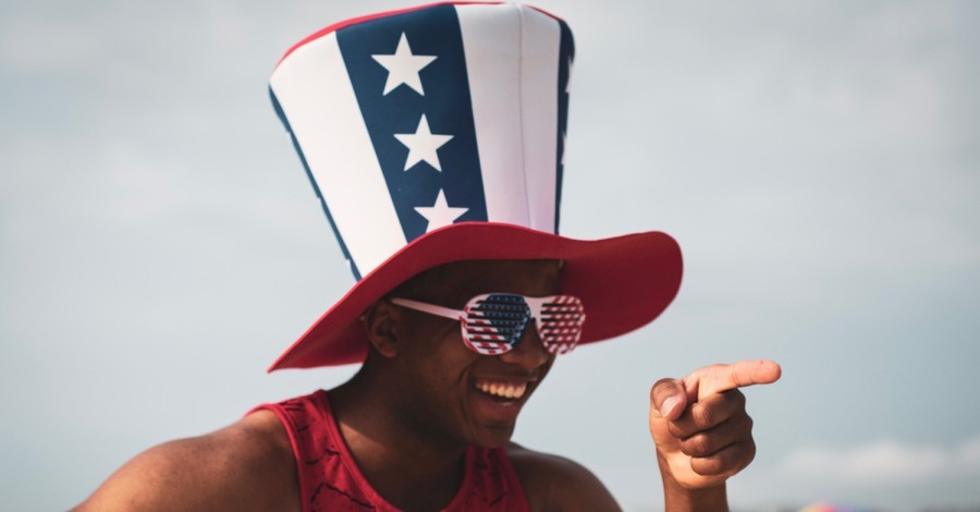 A man in USA hat and glasses, A new report found that red states are more patriotic than blue states