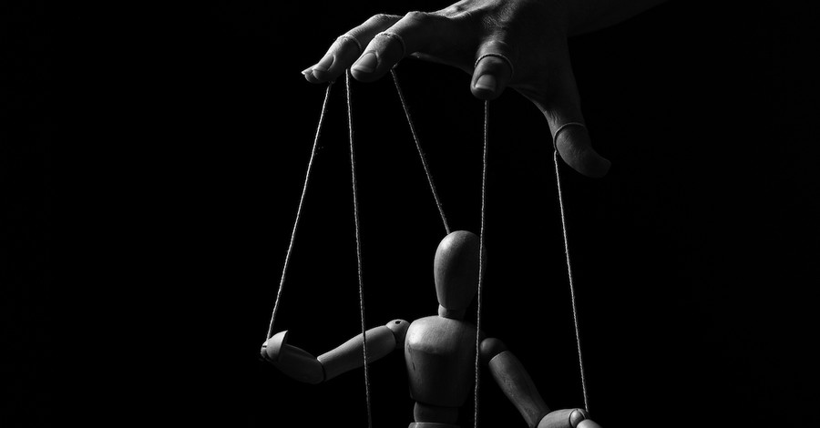 fingers controlling marionette, you are not your own