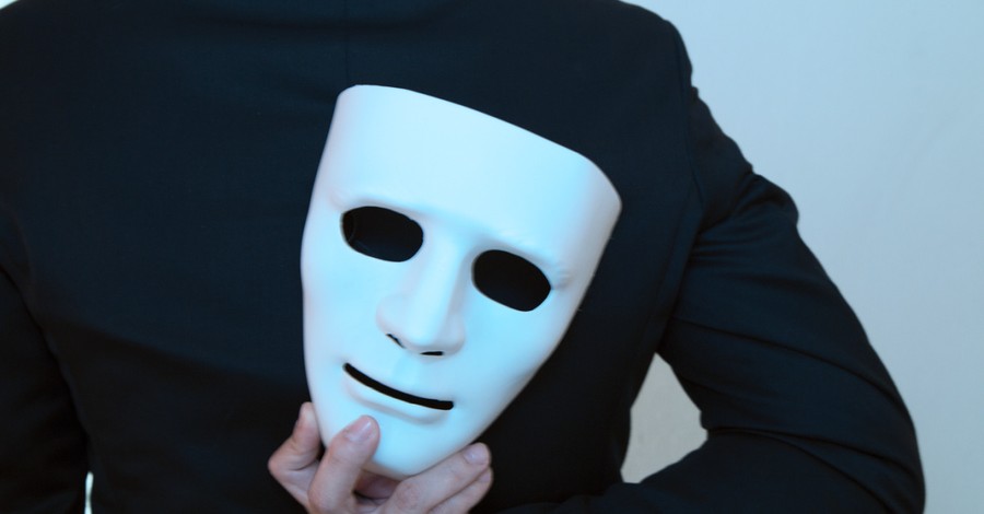a man holding a mask, hypocrisy in the church