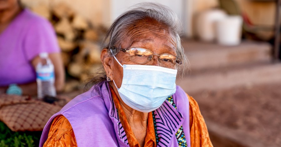 elderly Native American woman wearing a mask, Native American tribe member asks for prayer over the COVID-19 pandemic