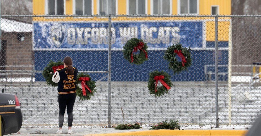 student Hanging wreaths on the Oxford Stadium fence, thousands sign petition to have Oxford stadium renamed after a student who allegedly attempted to disarm the school shooter