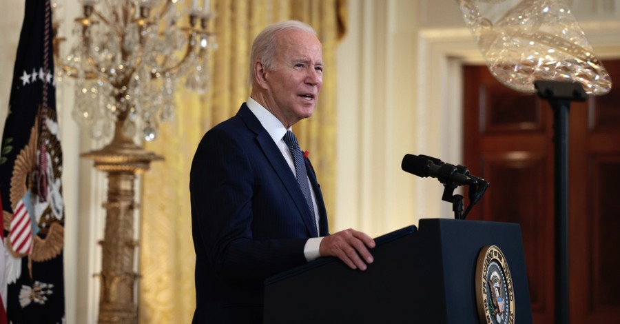 Joe Biden speaking at a podium, More than half of Americans blame Biden for national division