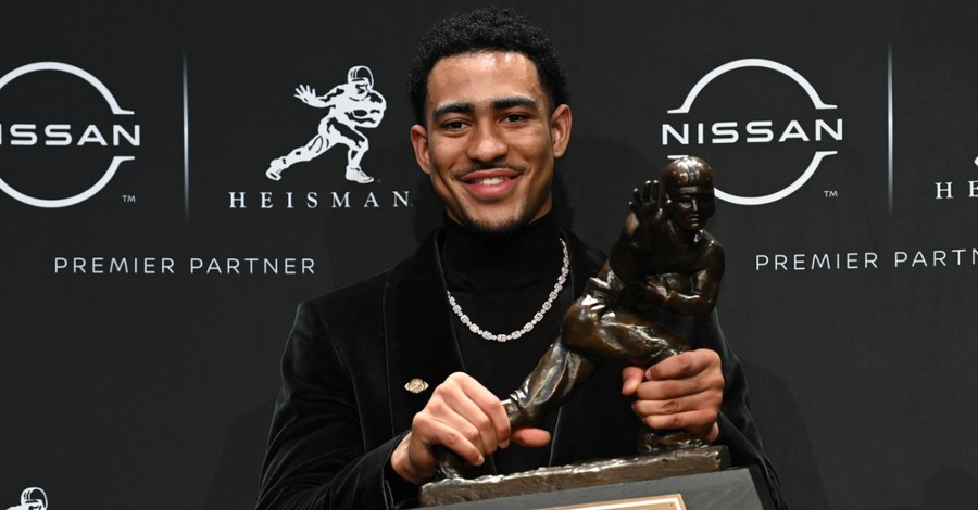 Bryce Young holding the Heisman Trophy, Young thanks God after being named Heisman trophy winner