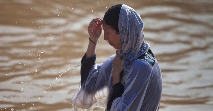 More than 20,000 Orthodox Christians Flock to Jordan River to Be Baptized