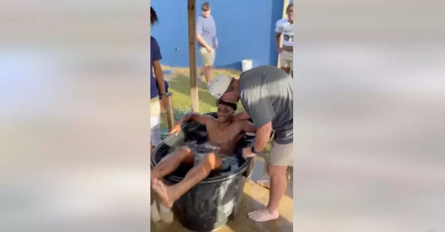 Football Coach Fired after Holding Baptism Ceremony for 20 Players Following Practice