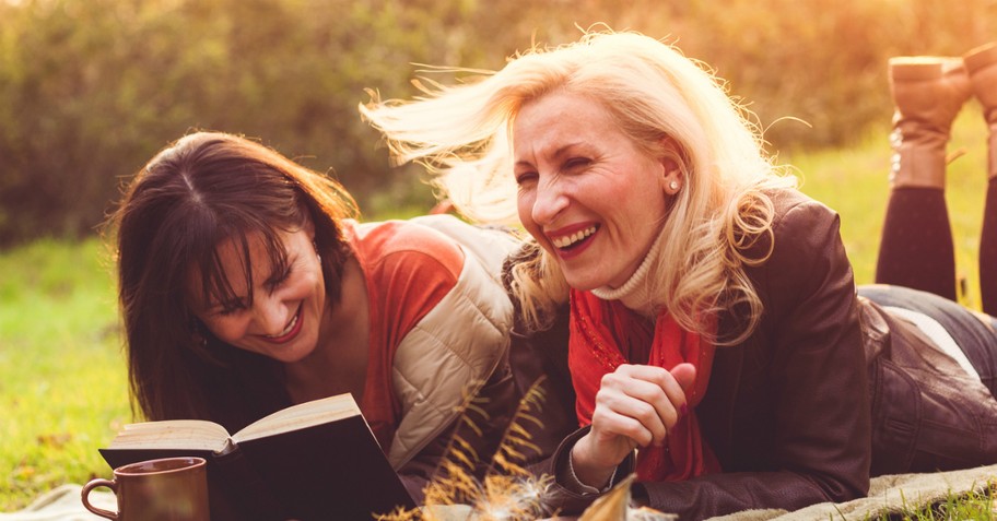 Two women laughing together