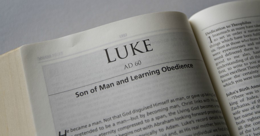 closeup of Bible open to top of book of Luke