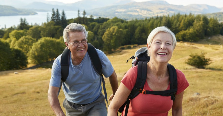 senior couple hiking in beautiful countryside