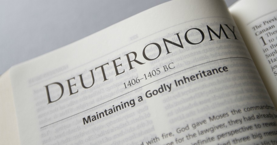 bible open to beginning of the book of deuteronomy