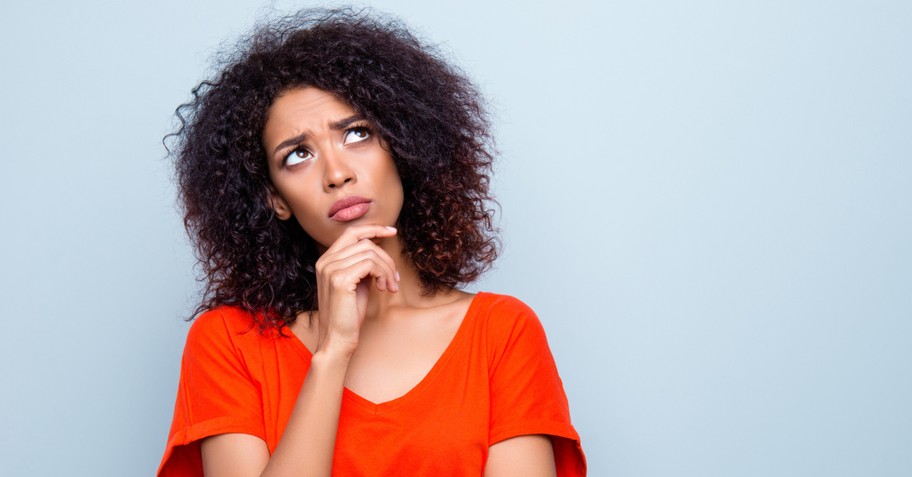 woman wondering looking up doubting