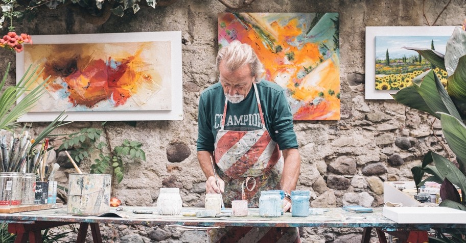 Man standing in front of his art studio