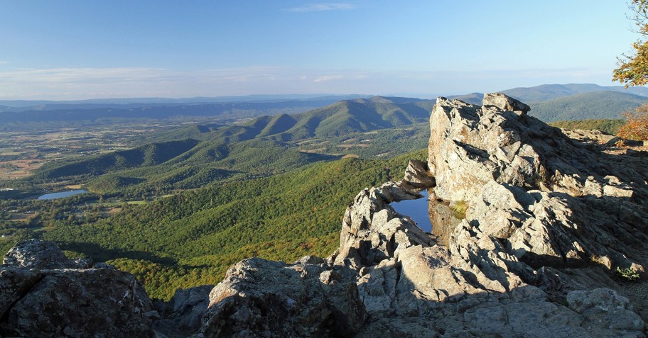 outdoor nature view of valley from mountain peak