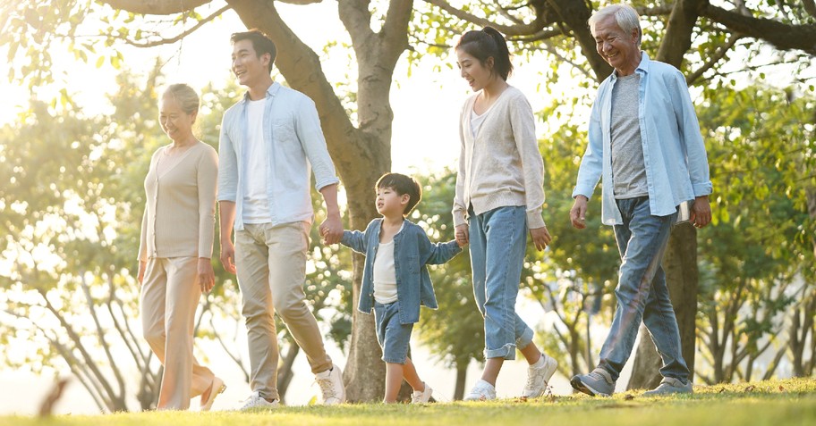 grandparents and adult children and grandkids walking