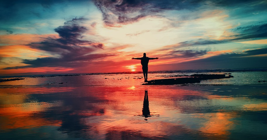 man worshipping god on beach, what is the holy spirit and how does it help us worship sanctification