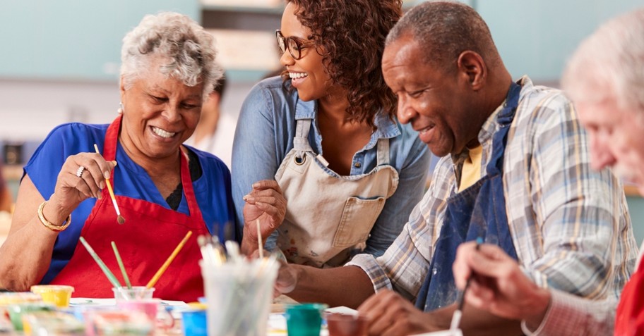 group of retired seniors taking art class