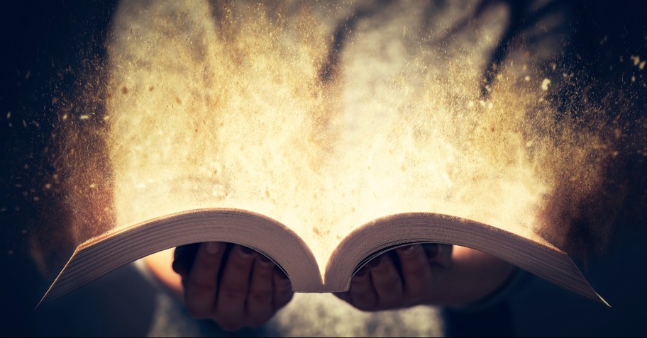 Glowing Bible in hands