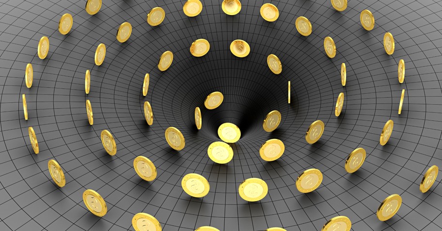 gold coins of money spinning down into dark funnel