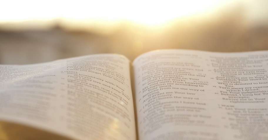 open Bible outside at sunrise