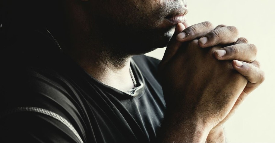 man praying, good friday traditions