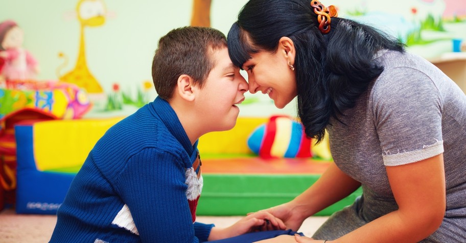 Mom smiling with special needs son