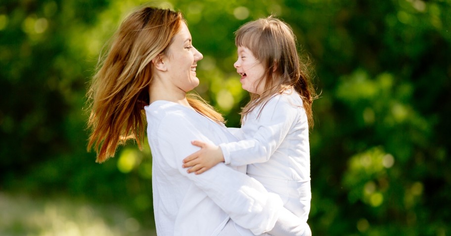 Mom and daughter smiling and laughing