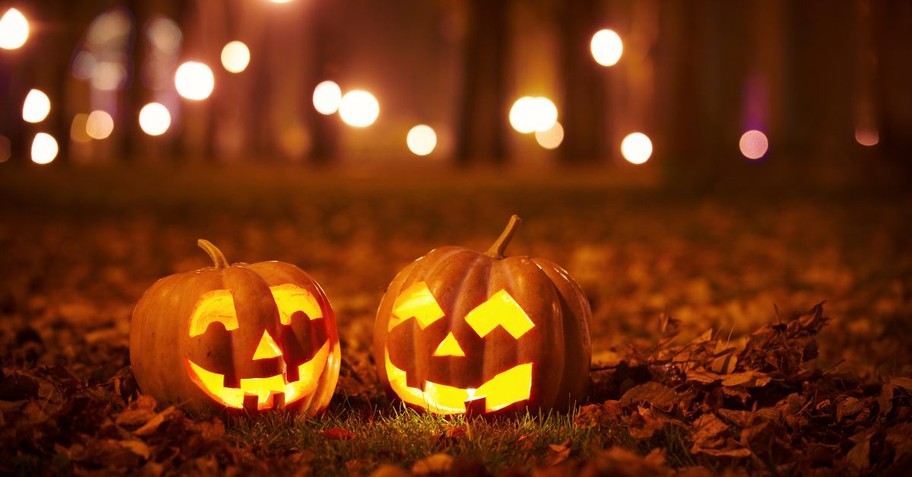 Jack o' Lanterns in the woods with fairy lights