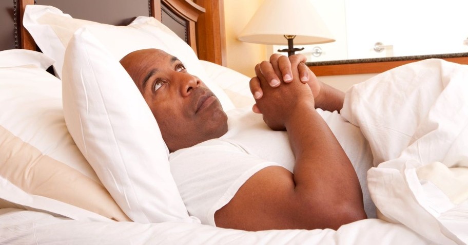 man in bed praying looking up, can you pray in your head