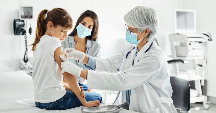 a child getting a vaccine, FDA advisory panel approves vaccines for kids