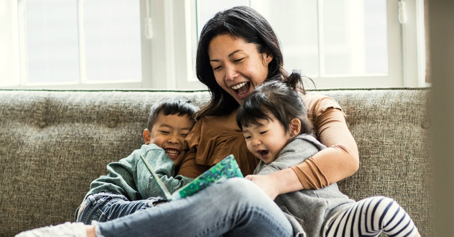 Mom reading to two small children