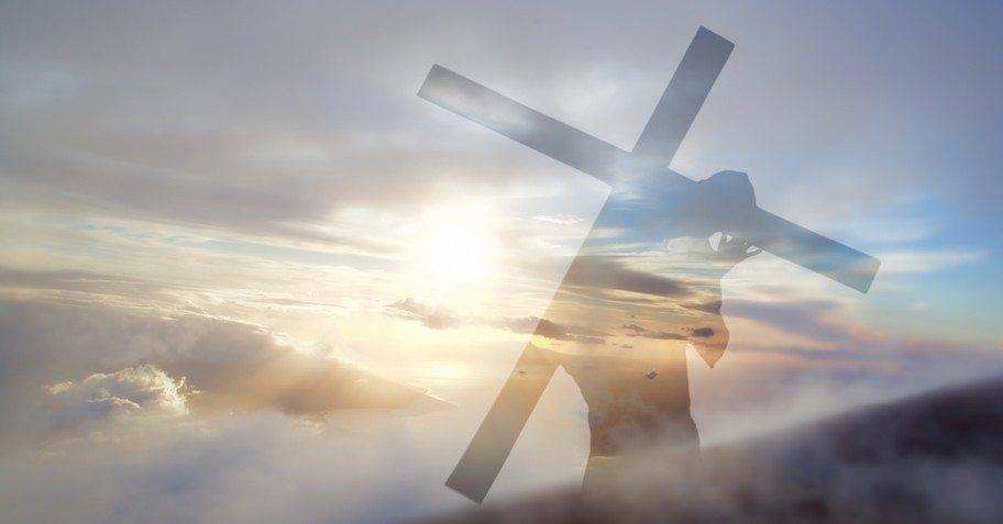 faded image of man carrying cross, what it means to follow Jesus