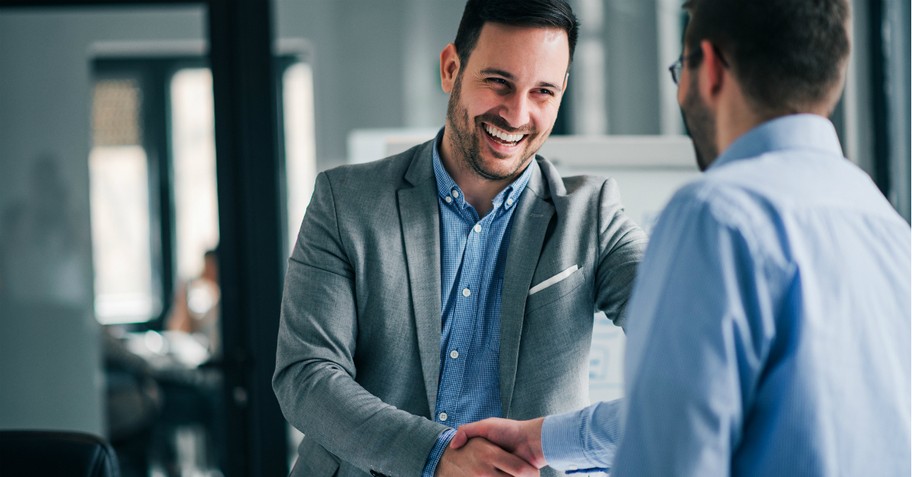 two business man handshake greeting