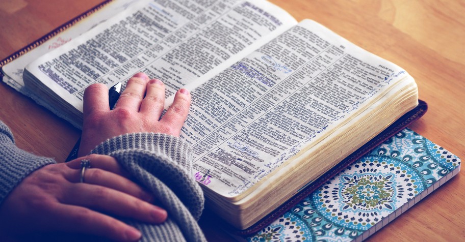 Woman reading an open Bible