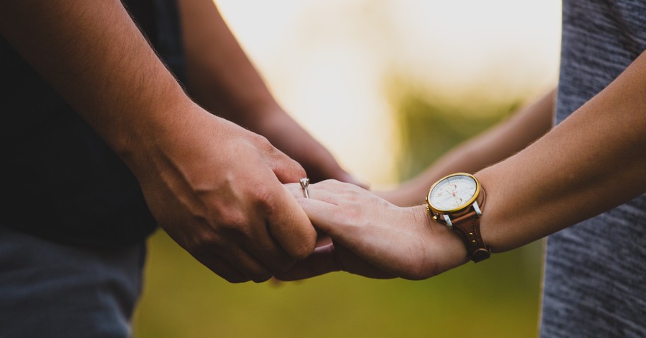 Couple holding hands