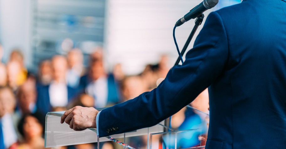 a man at a podium to illustrate who are evangelicals