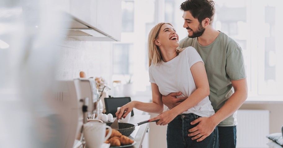 Wife helping husband with dinner