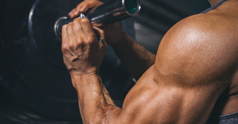Close-up shot of a man's large arm muscles