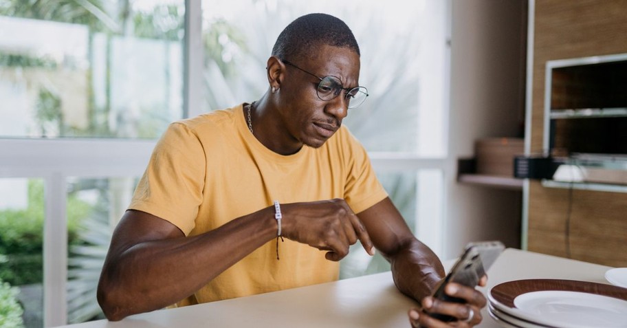 Looking at phone skeptical; thinking; discernment