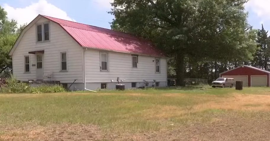 a photo of a house and the back yard