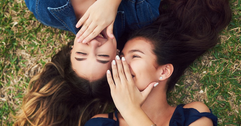 Young teen girls gossiping